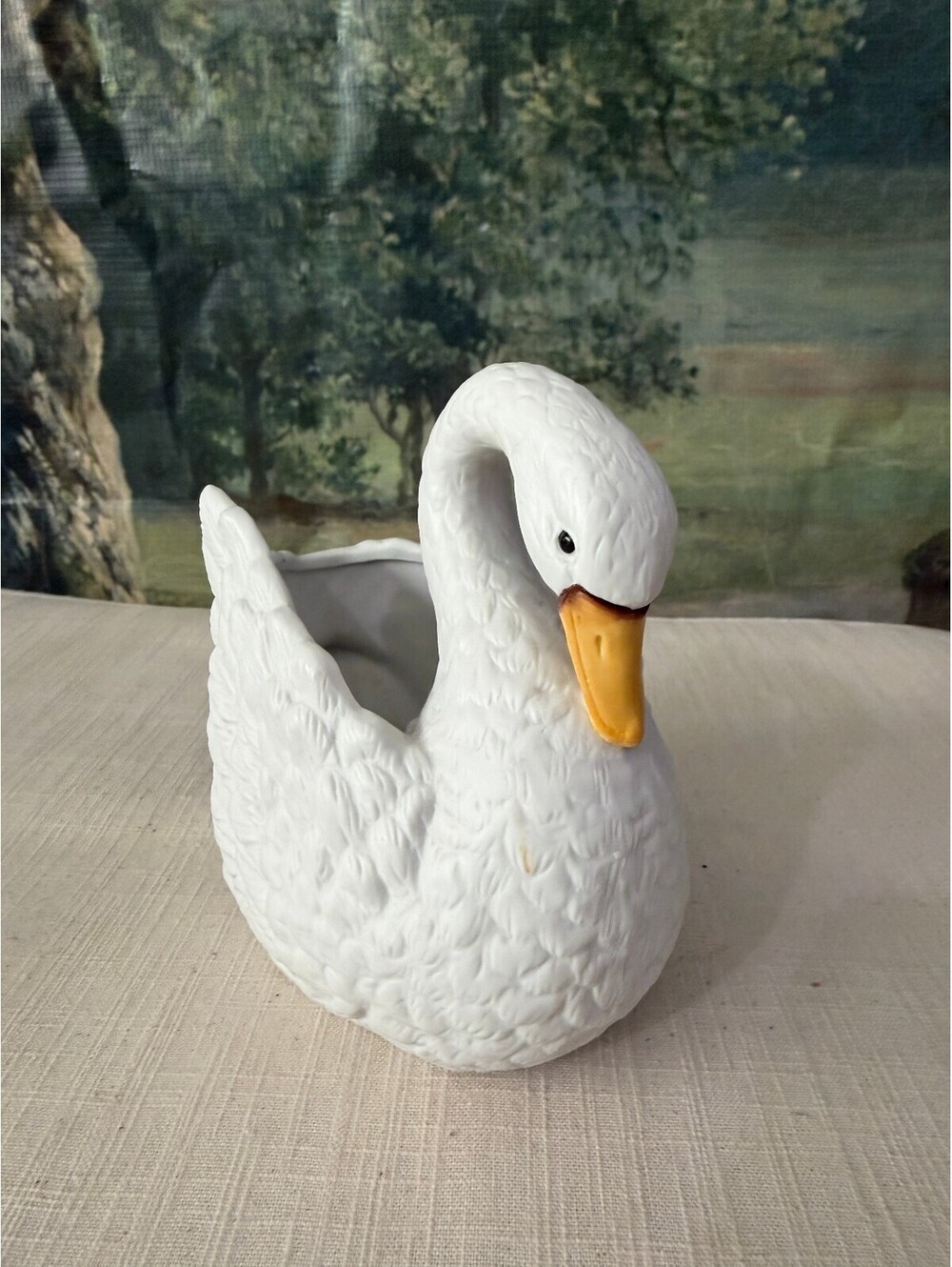 White ceramic swan planter